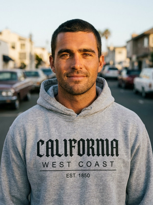 Man wearing California Vintage Script Hoodie t-shirt in California coastal town